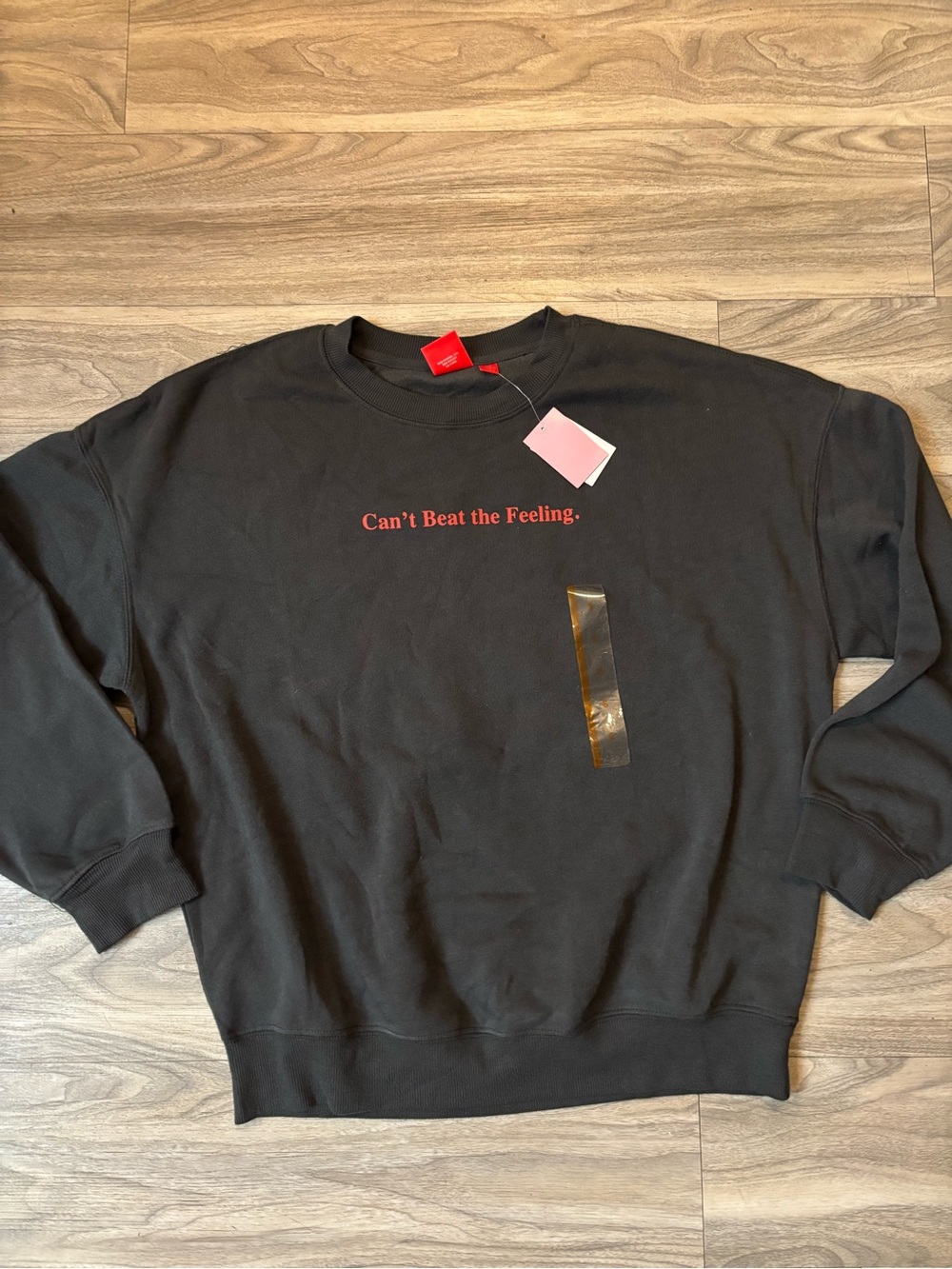 Black Crewneck Sweater with Red "Can't Beat the Feeling." Script